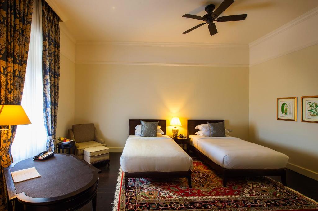 Postel nebo postele na pokoji v ubytování Galle Face Hotel