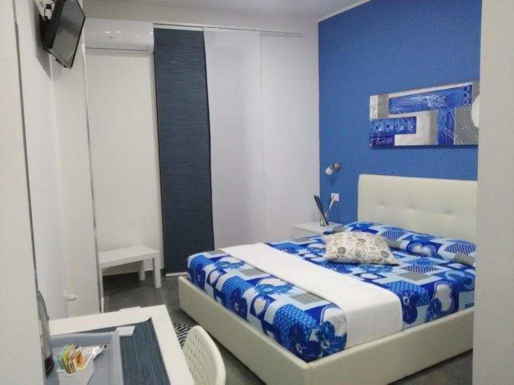 Letto o letti in una camera di B&B La Grotta