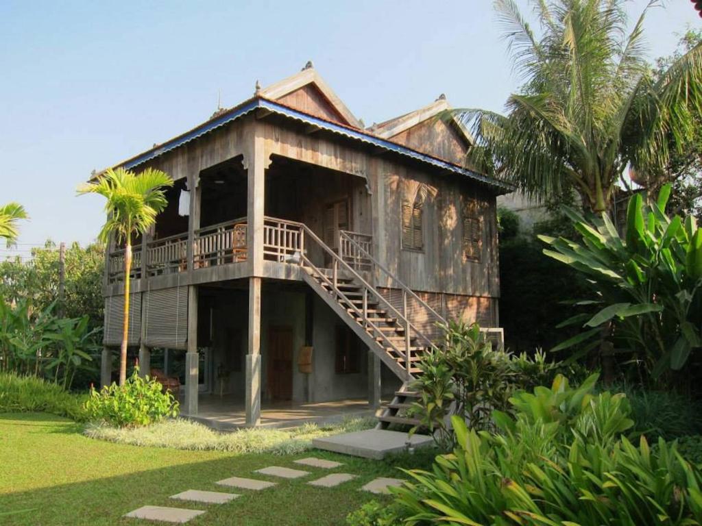 a house with a staircase in front of it at Sala Lodges in Siem Reap
