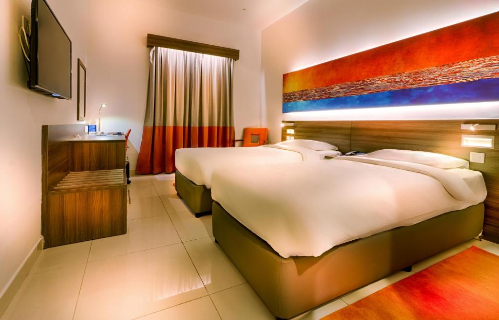 Postel nebo postele na pokoji v ubytování Citymax Hotel Al Barsha at the Mall
