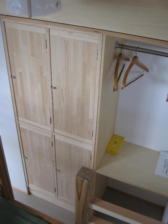 Postel nebo postele na pokoji v ubytování Guesthouse Hyakumanben Cross