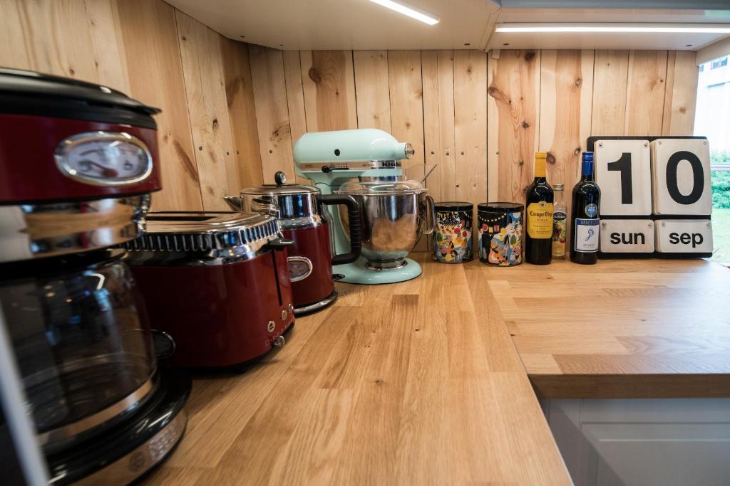 a kitchen with a counter top with bottles of wine at Tangs in Ísafjörður
