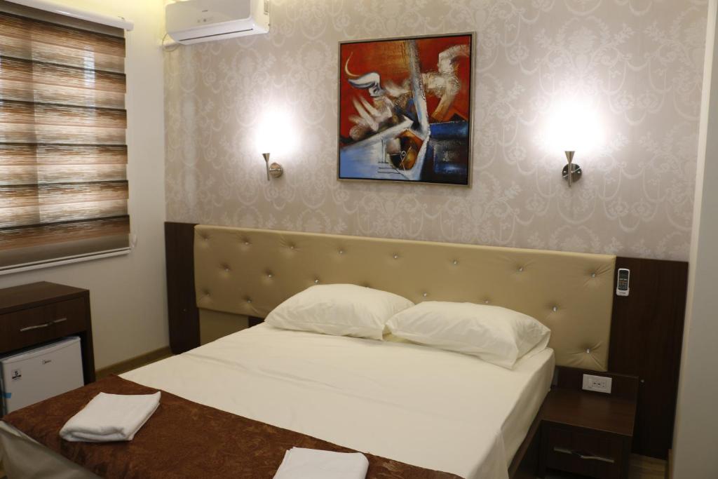 Postel nebo postele na pokoji v ubytování AEN Hotel-Old City