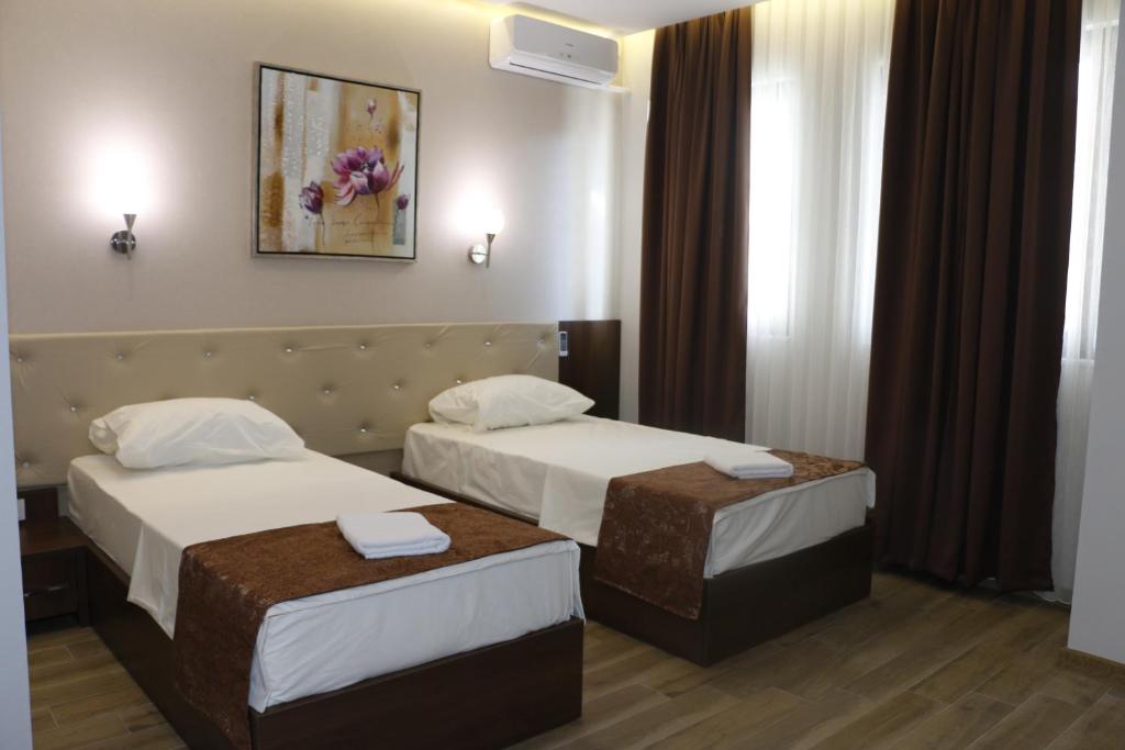 Postel nebo postele na pokoji v ubytování AEN Hotel-Old City