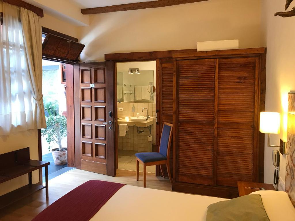 Postel nebo postele na pokoji v ubytování Gara Hotel