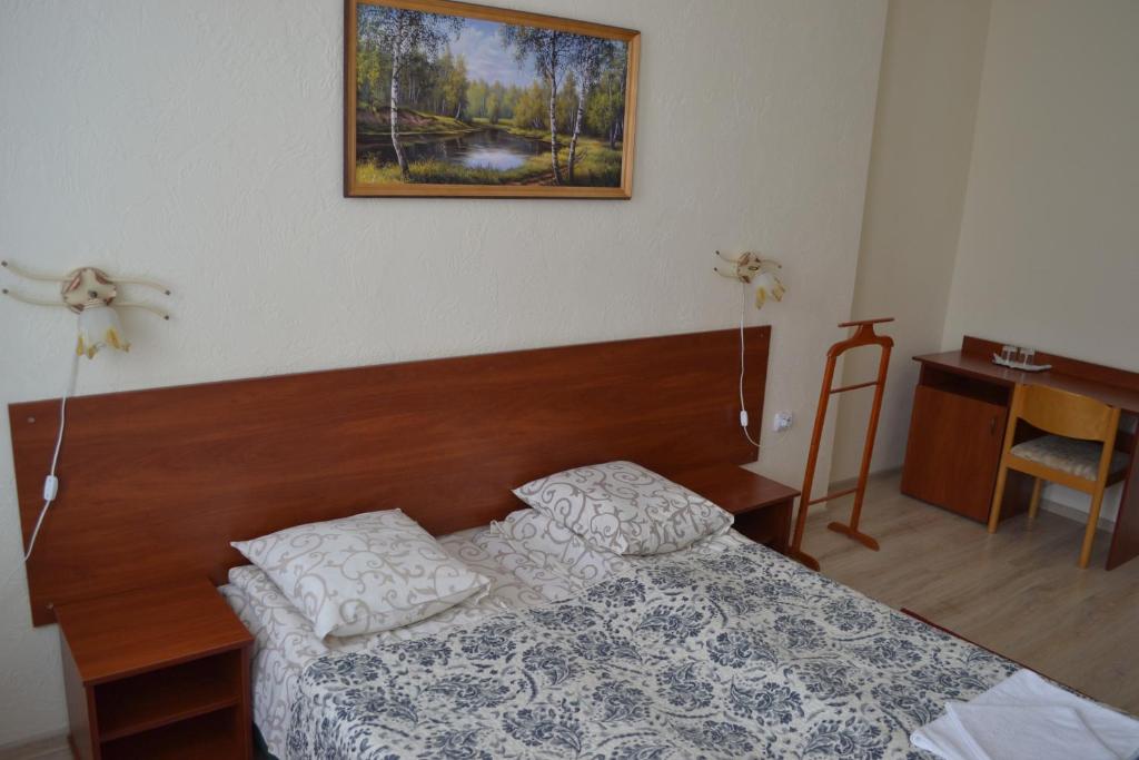 Postel nebo postele na pokoji v ubytování Hotel Helikon