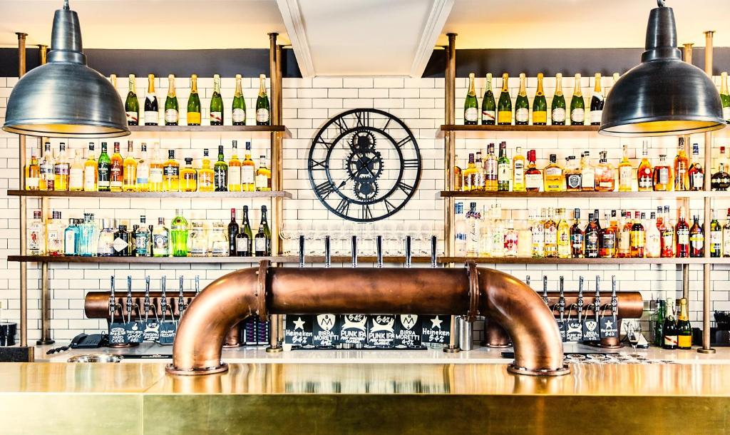 a bar with lots of bottles of alcohol at Avon Gorge by Hotel du Vin in Bristol