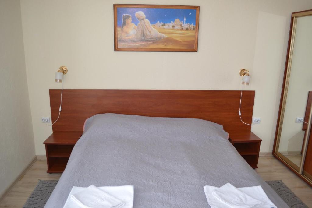 Postel nebo postele na pokoji v ubytování Hotel Helikon