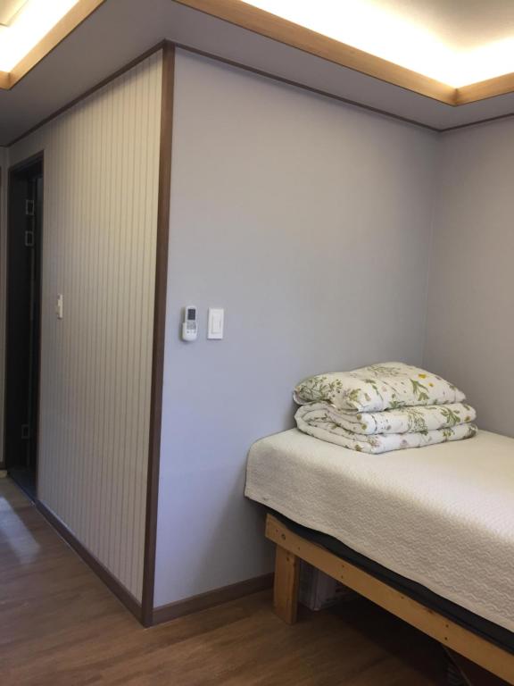Postel nebo postele na pokoji v ubytování Guest House Dalggume