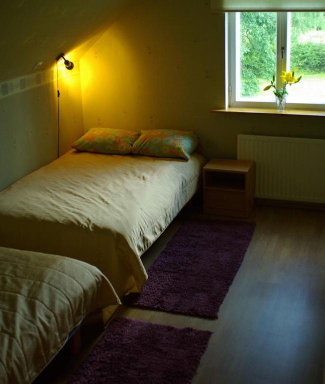 Postel nebo postele na pokoji v ubytování Vanasauna Guesthouse