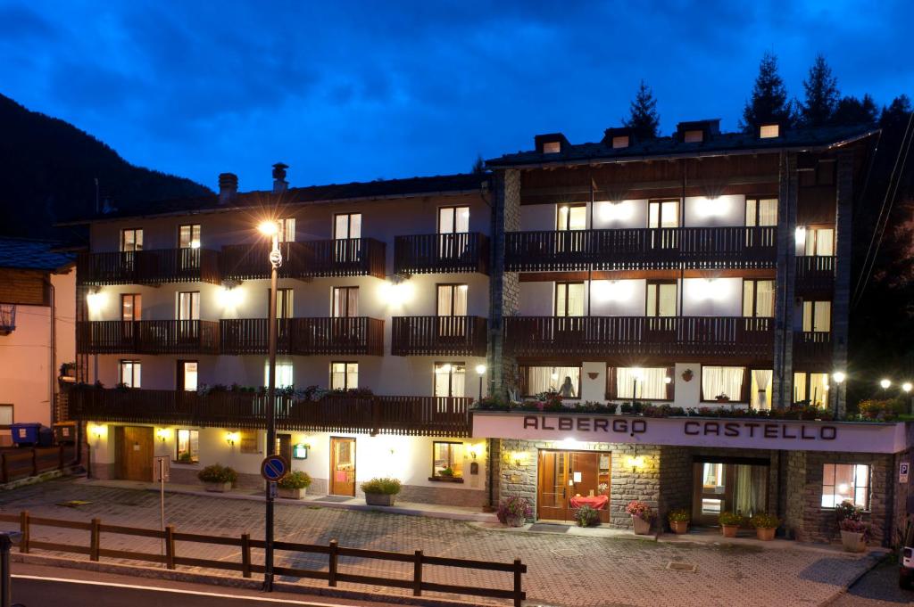 a hotel in the middle of a street at night at Albergo Castello da Bonino in Champorcher