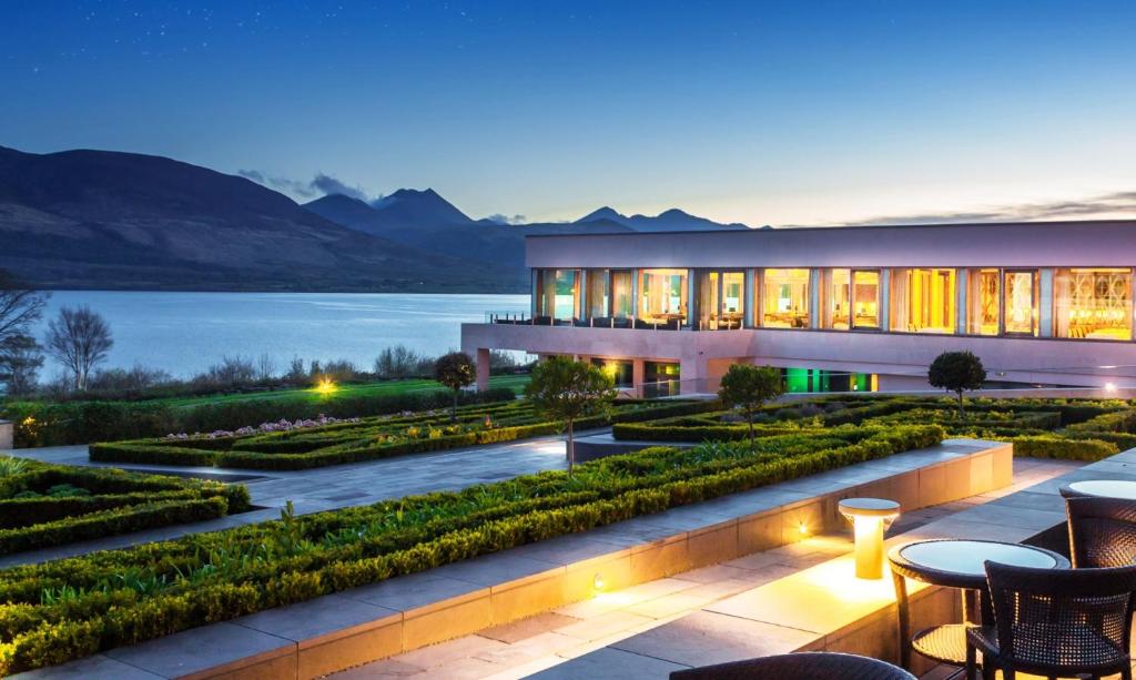 a building with a view of a lake and mountains at The Europe Hotel & Resort in Killarney