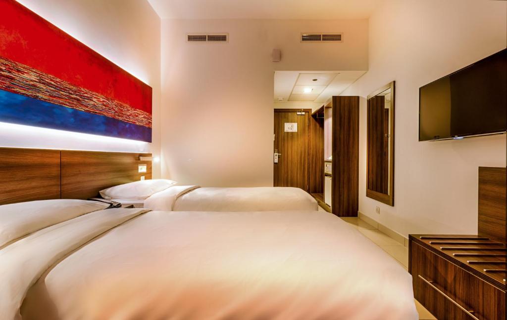 Postel nebo postele na pokoji v ubytování Citymax Hotel Al Barsha at the Mall