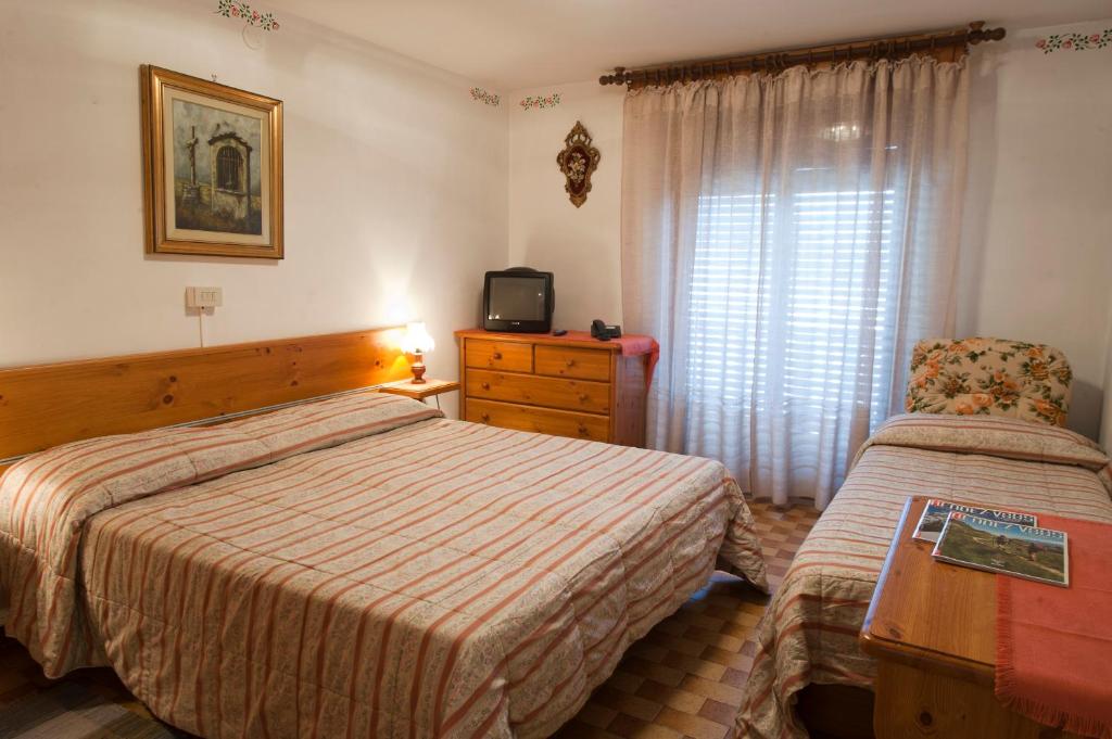 Postel nebo postele na pokoji v ubytování Albergo Castello da Bonino