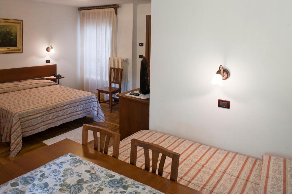 Postel nebo postele na pokoji v ubytování Albergo Castello da Bonino