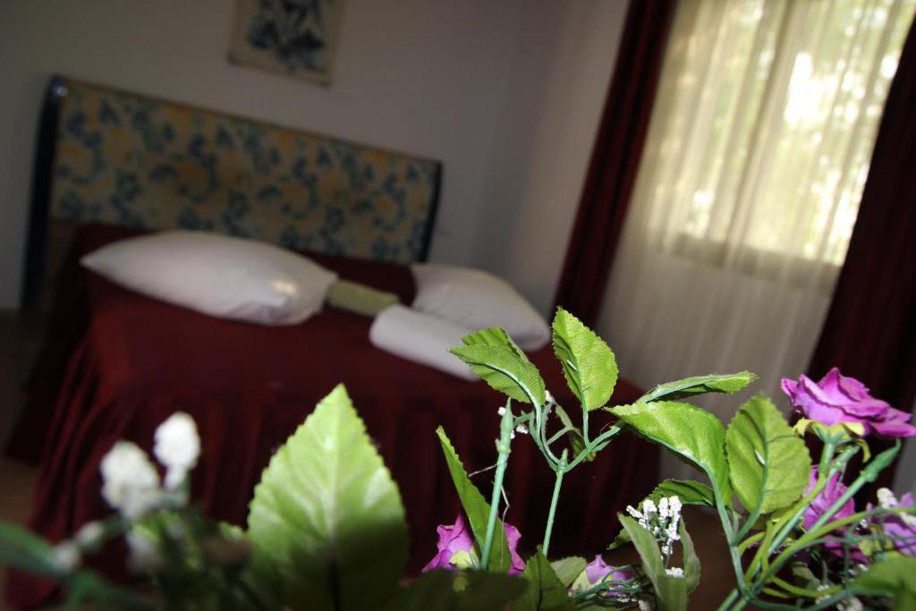 Postel nebo postele na pokoji v ubytování Hotel Doi Taurasi