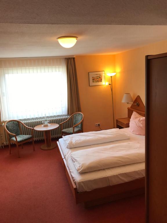 Postel nebo postele na pokoji v ubytování Hotel Martina