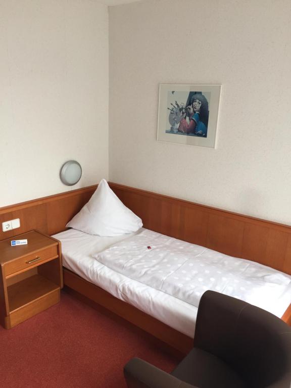 Postel nebo postele na pokoji v ubytování Hotel Martina