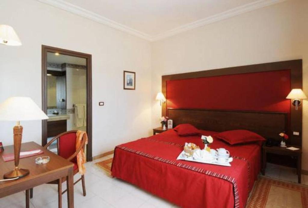 Postel nebo postele na pokoji v ubytování Hotel du Parc