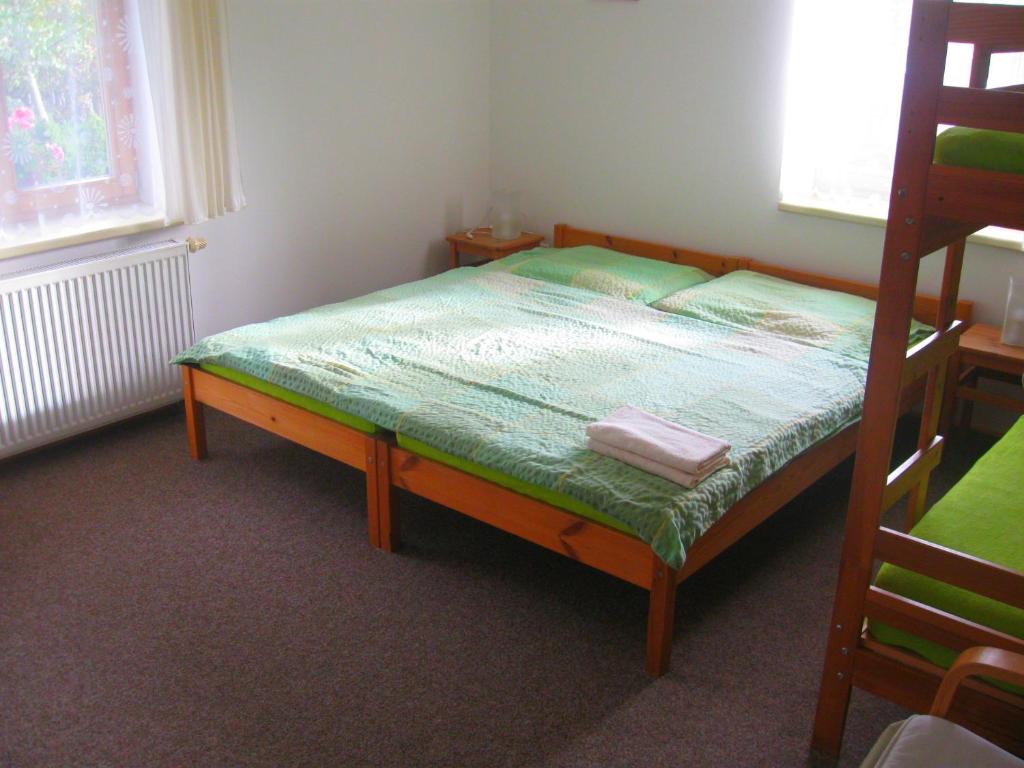 Łóżko lub łóżka w pokoju w obiekcie Ubytování na Slučím Tahu