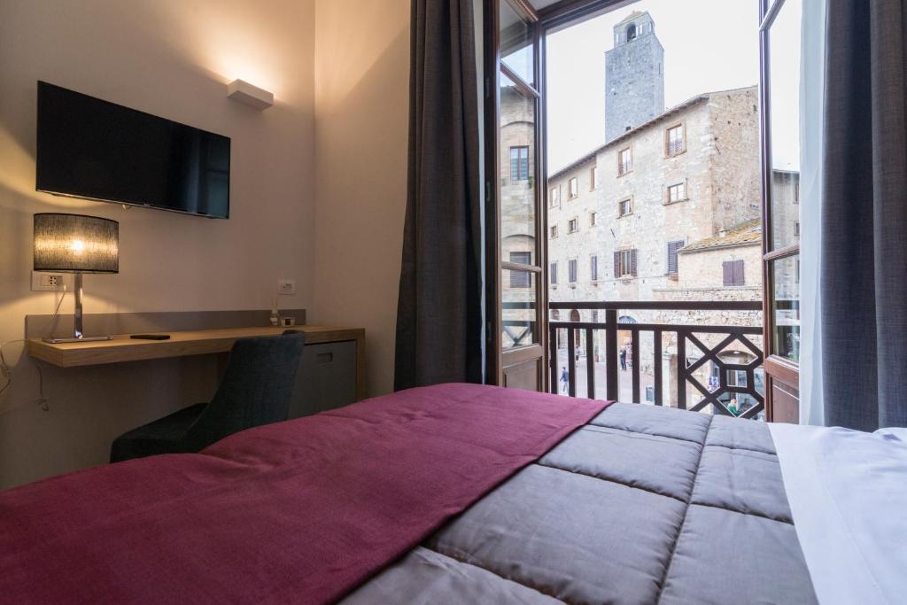 Postel nebo postele na pokoji v ubytování Hotel La Cisterna