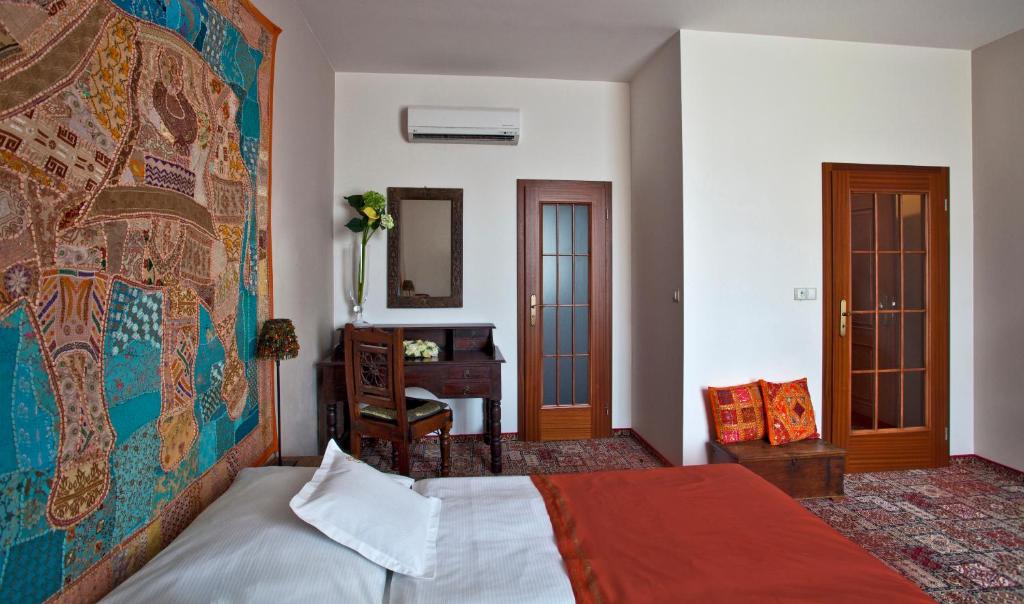 Postel nebo postele na pokoji v ubytování Hotel Tacl