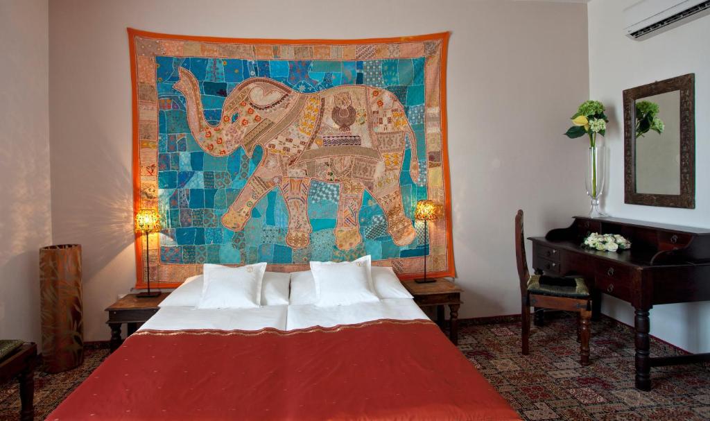 Postel nebo postele na pokoji v ubytování Hotel Tacl