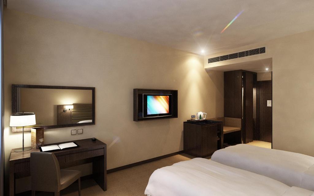 Postel nebo postele na pokoji v ubytování Lintas View Hotel