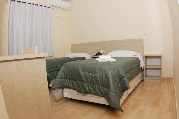 Postel nebo postele na pokoji v ubytování Hotel Turella