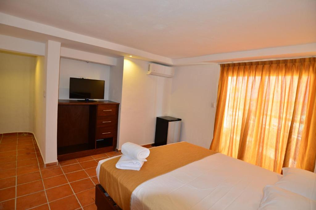 Postel nebo postele na pokoji v ubytování Hotel Rio Lagartos