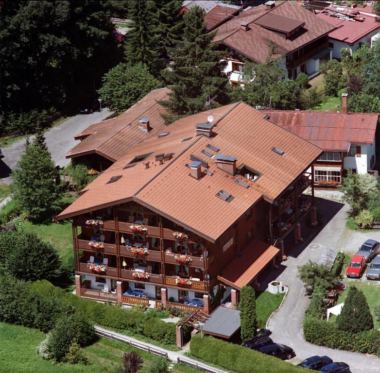 an aerial view of a house with a roof at Gästehaus zur Färbe Apartments in Oberstdorf