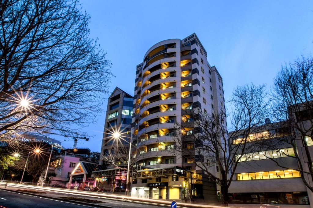 a tall building with windows on the side of a street at Quest Auckland Serviced Apartments in Auckland