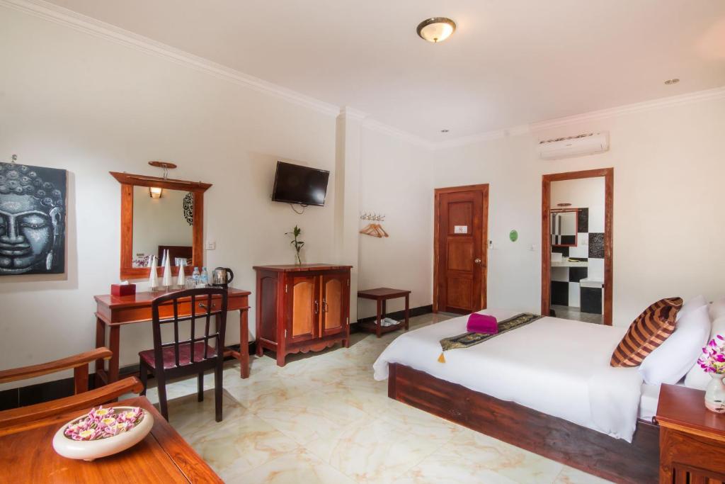 Postel nebo postele na pokoji v ubytování Angkor Udom Guesthouse