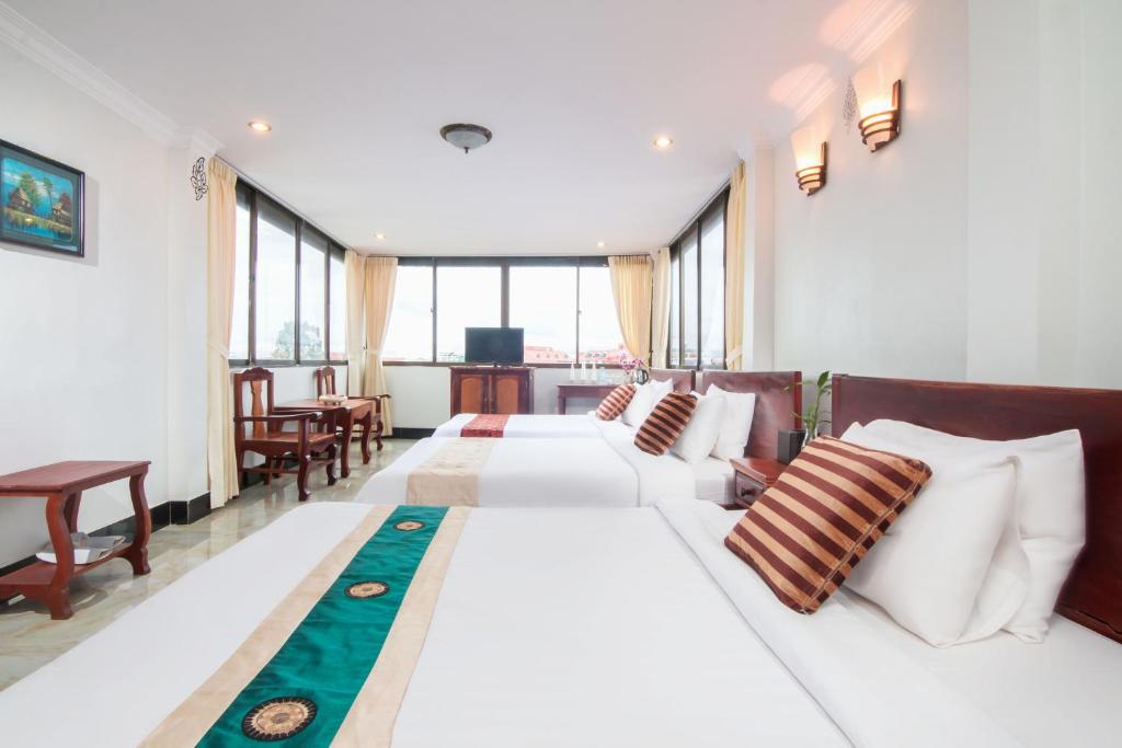 Postel nebo postele na pokoji v ubytování Angkor Udom Guesthouse