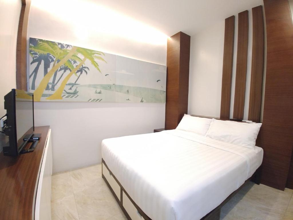 Postel nebo postele na pokoji v ubytování Bed and Bath Serviced Suites