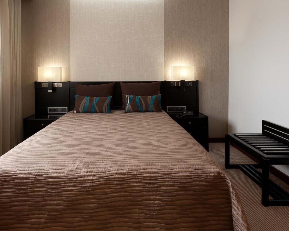 Postel nebo postele na pokoji v ubytování Cardal Hotel