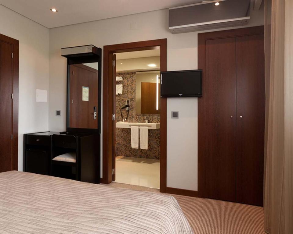 Postel nebo postele na pokoji v ubytování Cardal Hotel