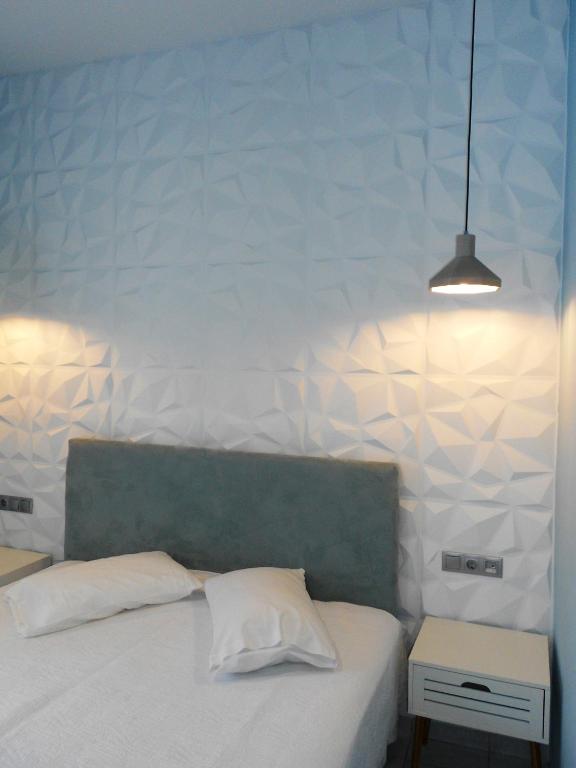 Voodi või voodid majutusasutuse Aggelos Hotel toas