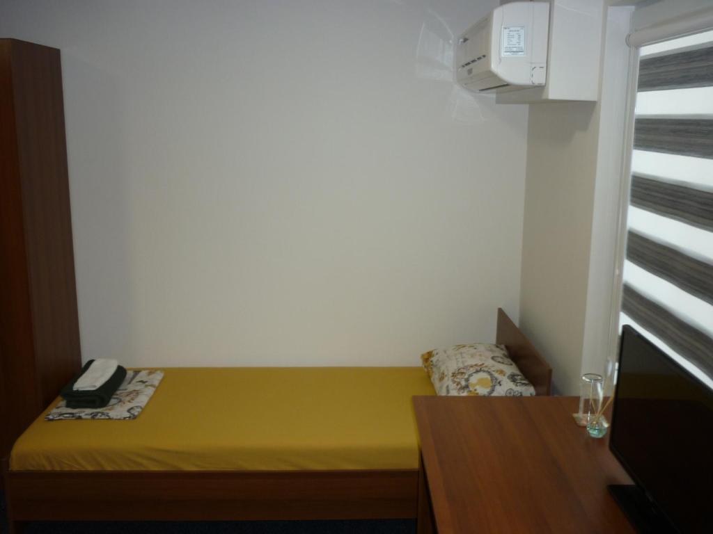 Postel nebo postele na pokoji v ubytování YALTA guesthouse