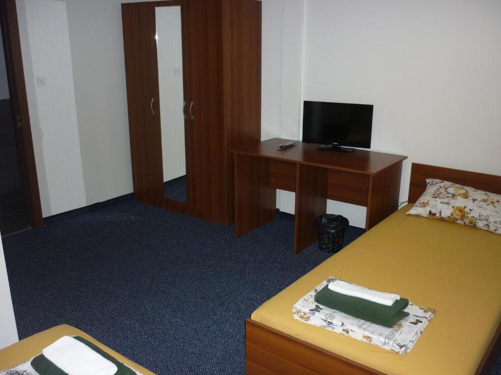 Postel nebo postele na pokoji v ubytování YALTA guesthouse