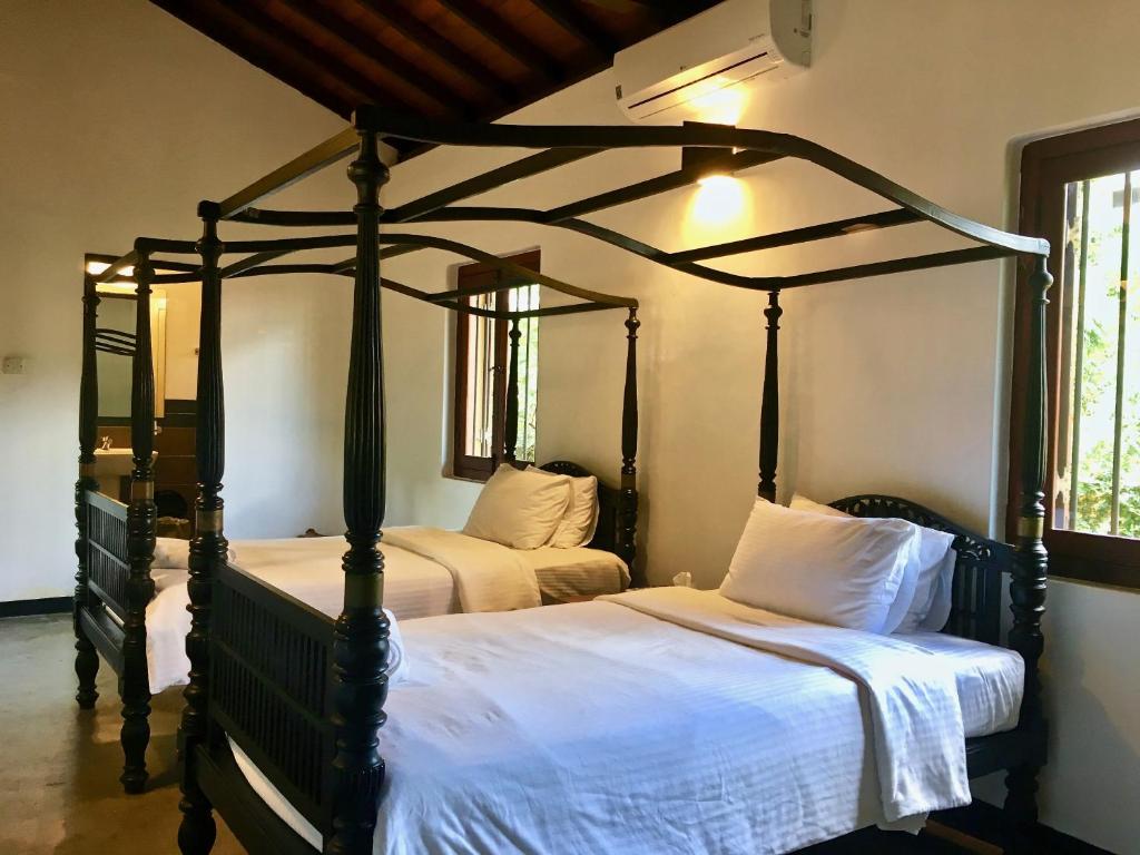 Postel nebo postele na pokoji v ubytování Villa Capers