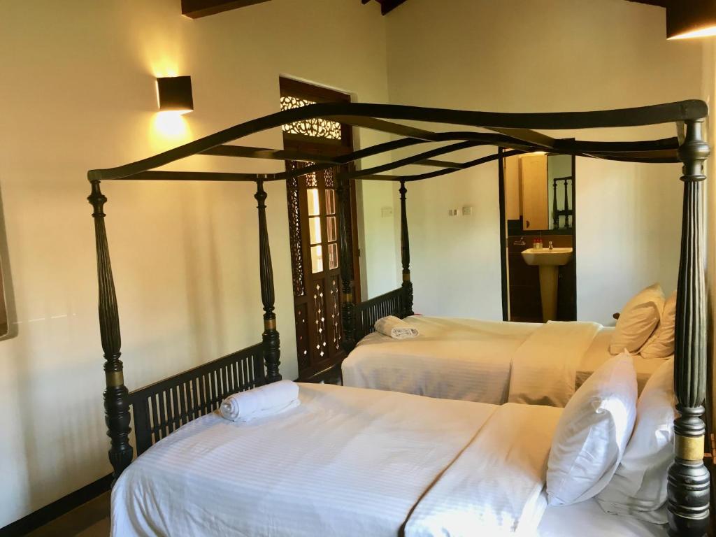 Postel nebo postele na pokoji v ubytování Villa Capers