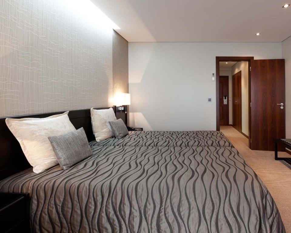 Postel nebo postele na pokoji v ubytování Cardal Hotel