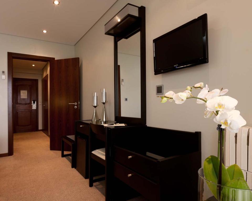 TV a/nebo společenská místnost v ubytování Cardal Hotel