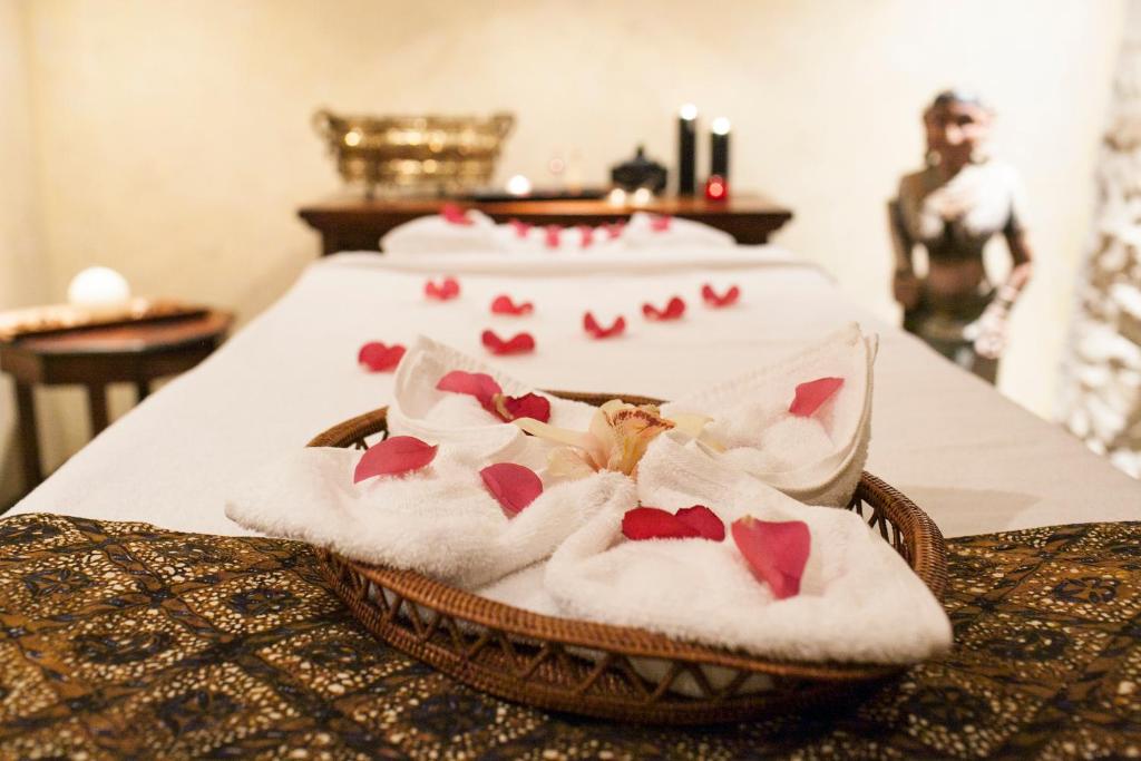 a group of towels on a bed with red hearts at Alchymist Grand Hotel and Spa - Preferred Hotels & Resorts in Prague