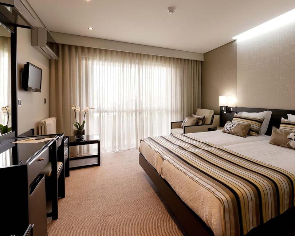 Postel nebo postele na pokoji v ubytování Cardal Hotel