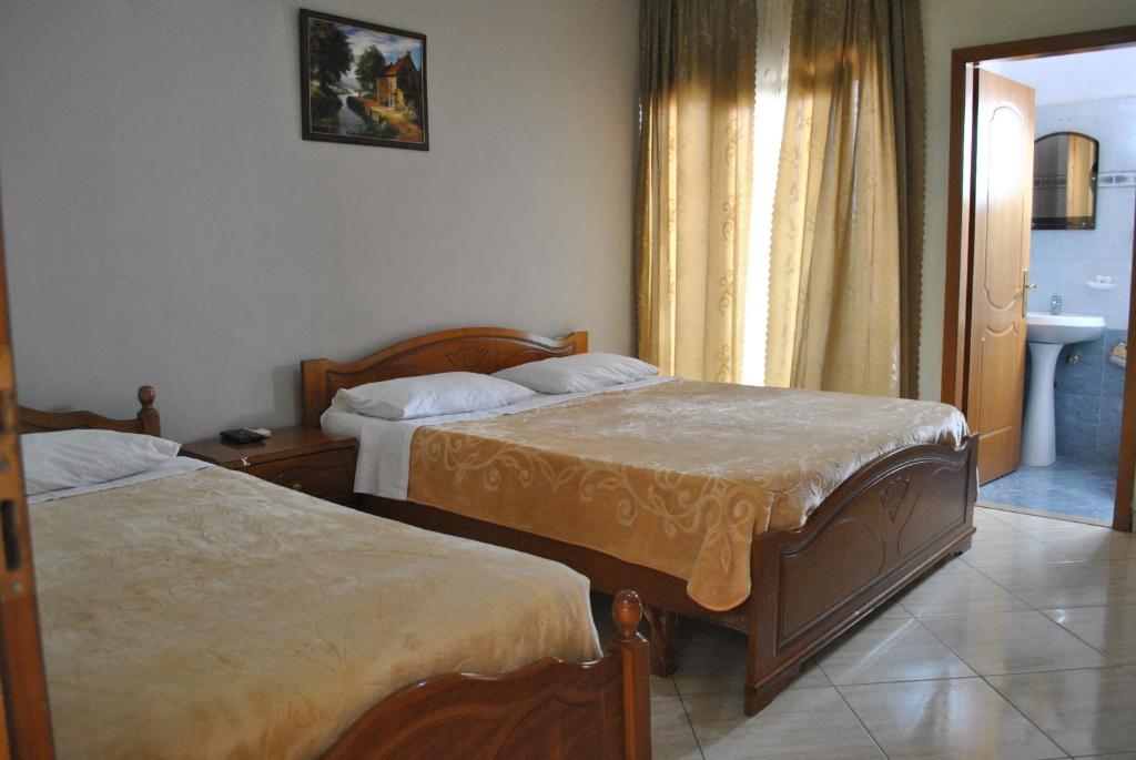 Postel nebo postele na pokoji v ubytování Eden Hotel