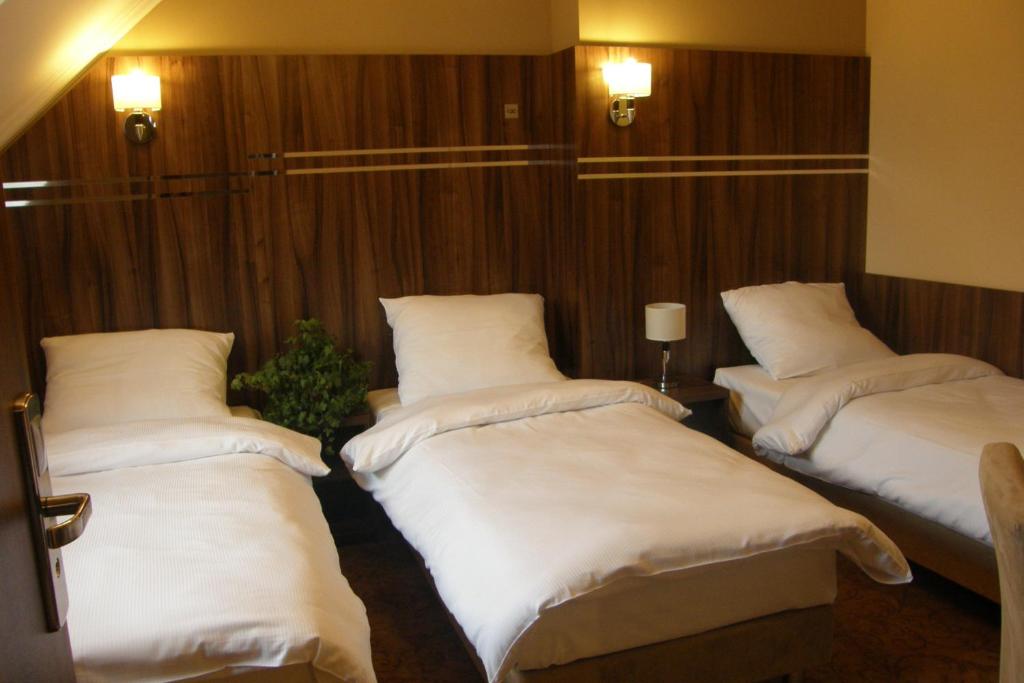 Posteľ alebo postele v izbe v ubytovaní Hotel Belfer