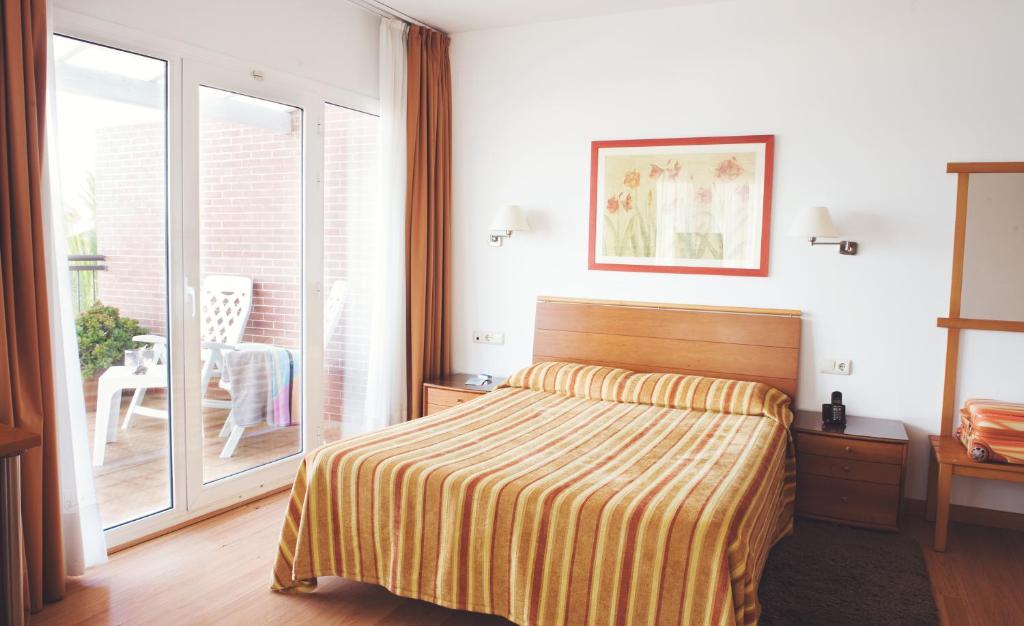 Posteľ alebo postele v izbe v ubytovaní Hotel Miramar Badalona