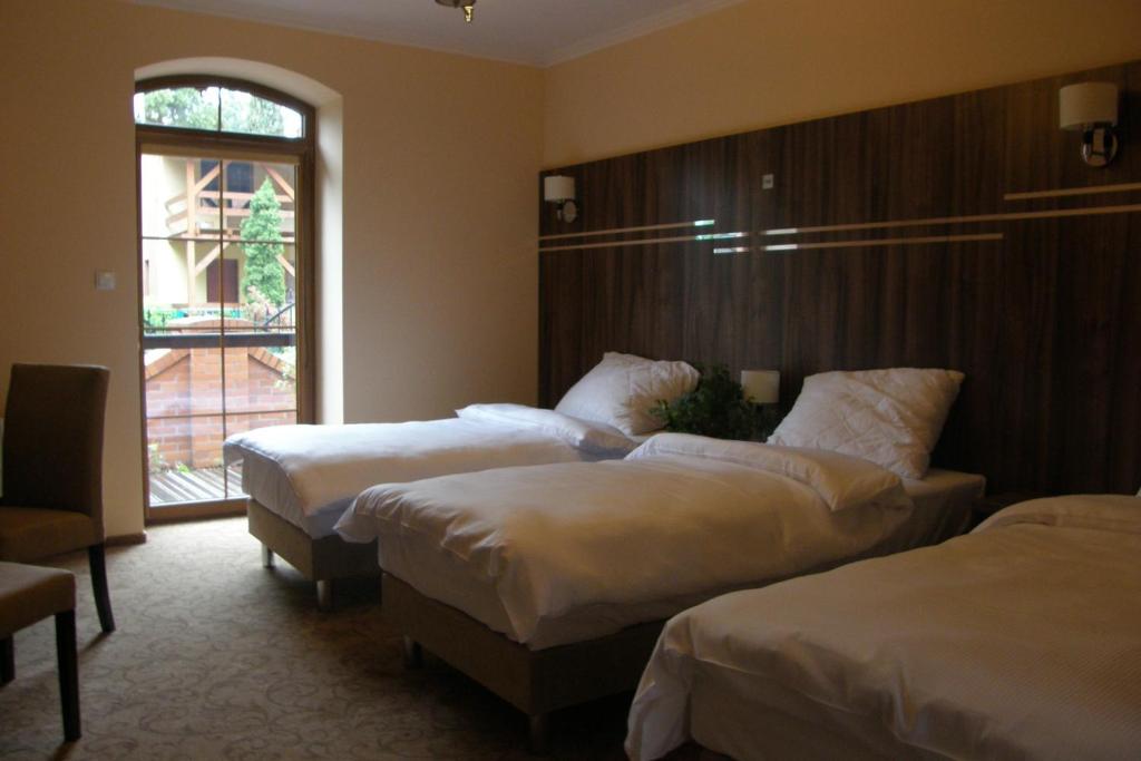 Posteľ alebo postele v izbe v ubytovaní Hotel Belfer